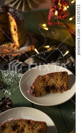 Traditional Panettone Slices and Loaf with Holiday Lights 139220721