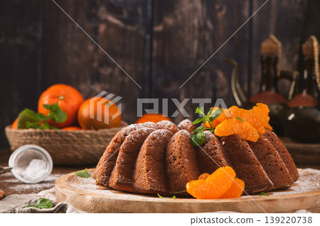Mandarin Bundt Cake with Powdered Sugar and Fresh Mint Mandarin Bundt Cake with Powdered Sugar and Fresh Mint 139220738
