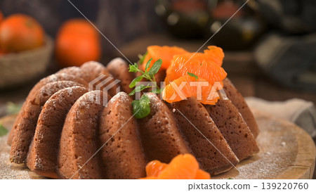 Mandarin Orange Bundt Cake with Powdered Sugar and Fresh Mint 139220760