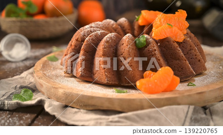 Glazed Tangerine Bundt Cake with Fresh Citrus Segments and Powdered Sugar Glazed Tangerine Bundt Cake with Fresh Citrus Segments and Powdered Sugar 139220765