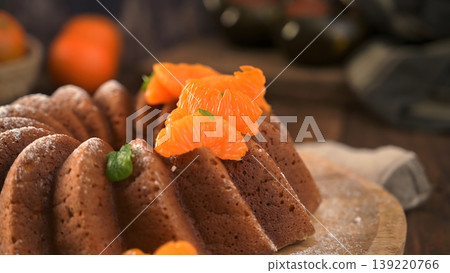 Glazed Orange Bundt Cake Topped with Fresh Mandarin Segments Glazed Orange Bundt Cake Topped with Fresh Mandarin Segments 139220766