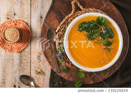 Creamy Pumpkin Soup with Fresh Spinach and Toasted Sesame Seeds 139220834