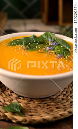 Creamy Pumpkin Soup with Spinach and Sesame Seeds 139220854