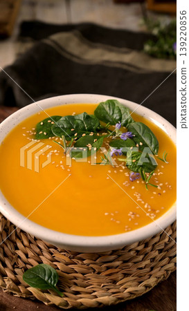 Creamy Butternut Squash Soup with Fresh Spinach and Sesame Seeds 139220856