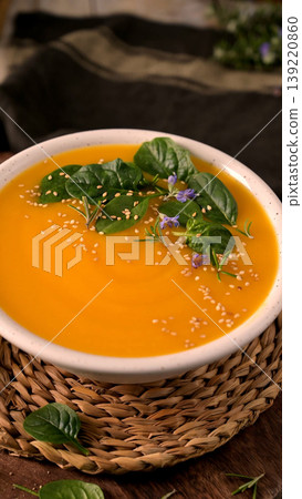 Creamy Pumpkin Soup with Spinach Rosemary and Sesame Seeds 139220860