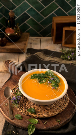 Healthy Pumpkin Soup with Spinach and Sesame Garnish 139220867
