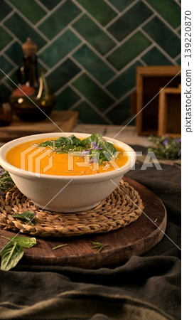 Creamy Butternut Squash Soup in a Rustic Bowl with Fresh Herbs and Seeds Creamy Butternut Squash Soup in a Rustic Bowl with Fresh Herbs and Seeds 139220870