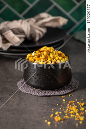 Savory Herb Cornbread Stuffing in a Modern Black Ceramic Bowl Savory Herb Cornbread Stuffing in a Modern Black Ceramic Bowl 139220877