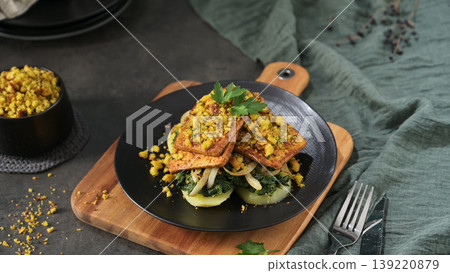 Crispy Herb Crusted Tofu over Sauteed Greens and Potatoes Crispy Herb Crusted Tofu over Sauteed Greens and Potatoes 139220879