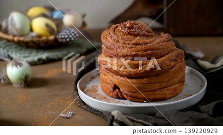 Fresh Cinnamon Roll with Easter Eggs and Spring Decor Fresh Cinnamon Roll with Easter Eggs and Spring Decor 139220929