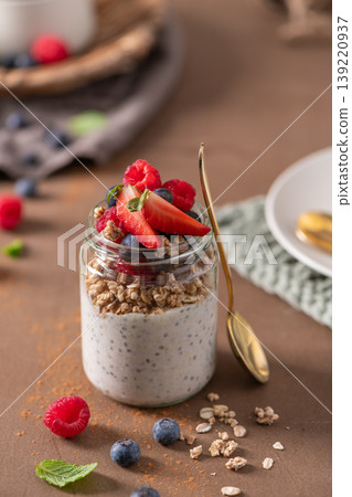 Healthy Chia Seed Pudding Parfait with Granola and Fresh Berries in a Glass Jar Healthy Chia Seed Pudding Parfait with Granola and Fresh Berries in a Glass Jar 139220937