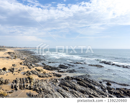 Rocky Shoreline at Praia da Granja with Ocean Waves and Cloudy Sky Rocky Shoreline at Praia da Granja with Ocean Waves and Cloudy Sky 139220980