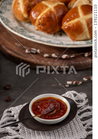 Fresh Baked Hot Cross Buns with Fruit Jam and Pussy Willow Accents 139221110