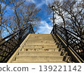 Outdoor Staircase Bridge Leading Upward Under Blue Sky 139221142