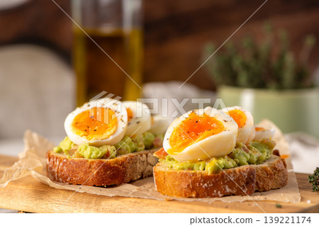 Avocado Toast with Soft Boiled Eggs and Black Pepper on Sourdough Avocado Toast with Soft Boiled Eggs and Black Pepper on Sourdough 139221174