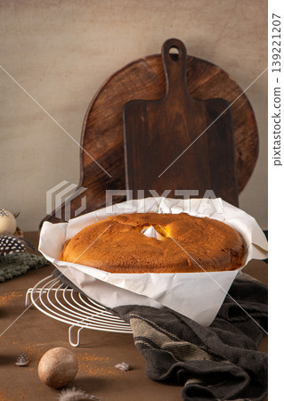 Freshly Baked Sponge Cake on Cooling Rack with Rustic Wood Background Freshly Baked Sponge Cake on Cooling Rack with Rustic Wood Background 139221207