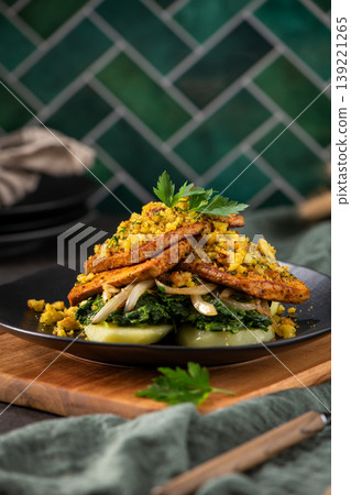 Gourmet Seared Tofu Steaks with Sauteed Greens and Crispy Topping Gourmet Seared Tofu Steaks with Sauteed Greens and Crispy Topping 139221265