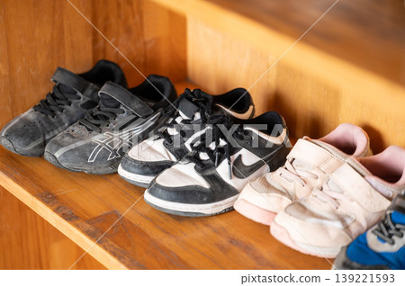 Shoe rack space where children's shoes are lined up Shoe rack space where children's shoes are lined up 139221593