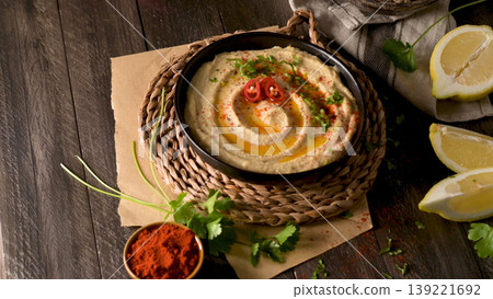 Delicious hummus in ceramic bowl Delicious hummus in ceramic bowl 139221692