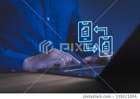 Data transfer and file sharing concept. Hand using laptop with neon mobile sync icon. Digital document exchange, technology communication, internet connection and business transformation. Data transfer and file sharing concept. Hand using laptop with neon mobile sync icon. Digital document exchange, technology communication, internet connection and business transformation. 139221804