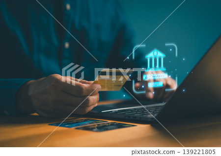 Secure online banking and digital finance concept with man using credit card for internet payment, login on laptop technology for e-commerce transactions. 139221805