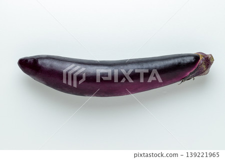 A top-down view of a single long eggplant (white background, with space for copying). A top-down view of a single long eggplant (white background, with space for copying). 139221965
