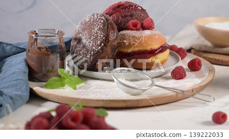 Assorted Gourmet Filled Doughnuts with Chocolate and Raspberry 139222033