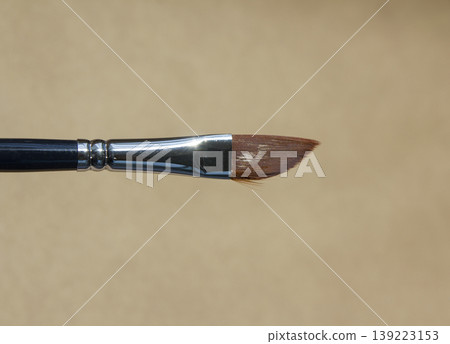 Acrylic brush on a brown background. Acrylic brush on a brown background. 139223153