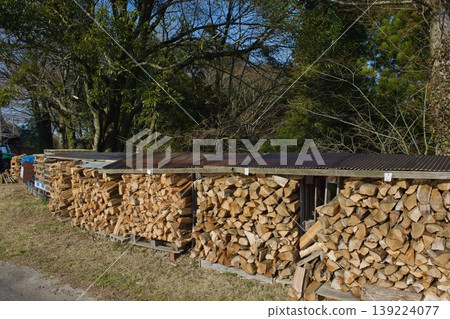 Firewood piled up outdoors Firewood piled up outdoors 139224077