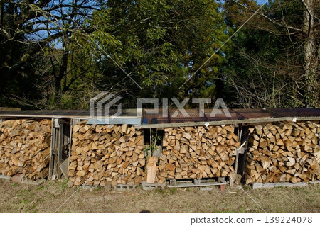Firewood piled up outdoors Firewood piled up outdoors 139224078