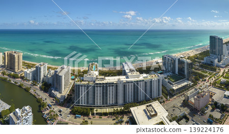 Popular vacation spot in the United States. Ocean warm waters and sandy beachfront at Miami Beach in Florida, USA. American travel destination Popular vacation spot in the United States. Ocean warm waters and sandy beachfront at Miami Beach in Florida, USA. American travel destination 139224176