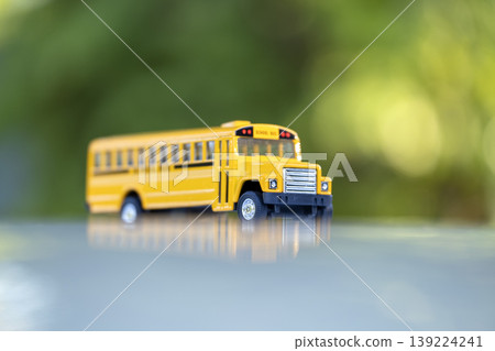 Model of classical american yellow school bus for transporting of kids to and from school every day. Concept of education in the USA Model of classical american yellow school bus for transporting of kids to and from school every day. Concept of education in the USA 139224241