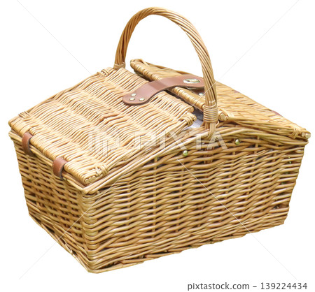 An image of a rattan picnic basket taken from an angle. 139224434