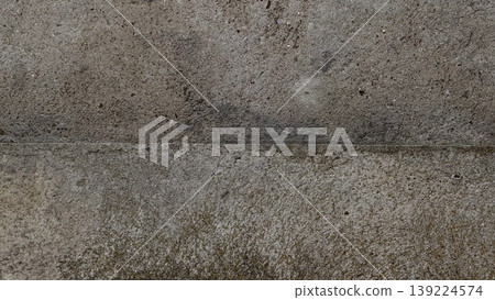 Versatile gray concrete wall texture for backgrounds and designs. Versatile gray concrete wall texture for backgrounds and designs. 139224574