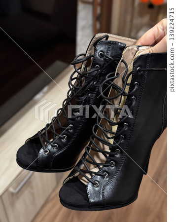 Elegant black high heels with lace-up design, perfect for chic outfits. Elegant black high heels with lace-up design, perfect for chic outfits. 139224715