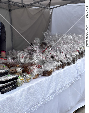 A variety of baked treats neatly packaged for sale. A variety of baked treats neatly packaged for sale. 139224719