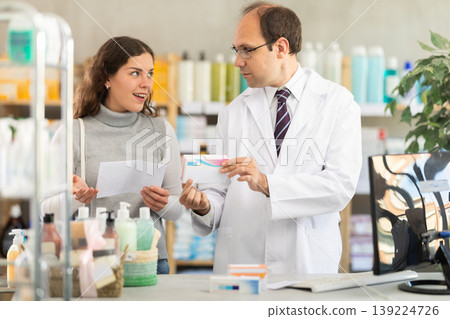Pharmacist gives woman buyer prescription pills Pharmacist gives woman buyer prescription pills 139224726