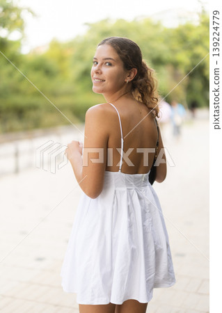 Young woman walking in city park Young woman walking in city park 139224779