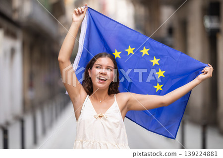 Young woman with EU flag on city street 139224881
