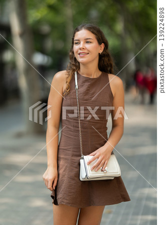 Young woman walking around summer european city 139224898