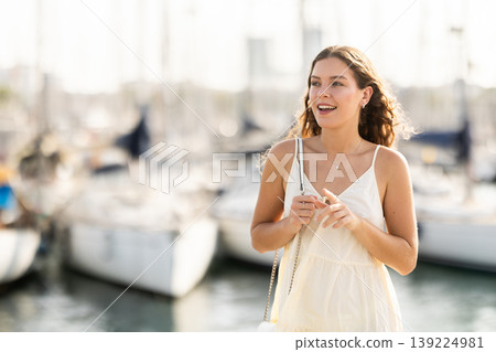Young woman posing at yacht port 139224981