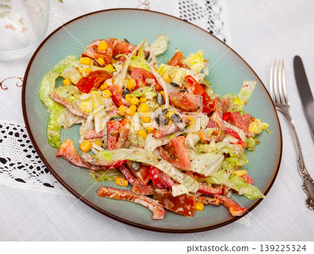 On plate, portion is laid out with pim salad of corn, cabbage, mayonnaise. On plate, portion is laid out with pim salad of corn, cabbage, mayonnaise. 139225324