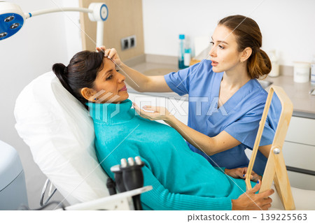 Woman having consultation at aesthetic medicine clinic Woman having consultation at aesthetic medicine clinic 139225563