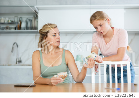 Woman received salary giving pocket money to teenage daughter 139225645