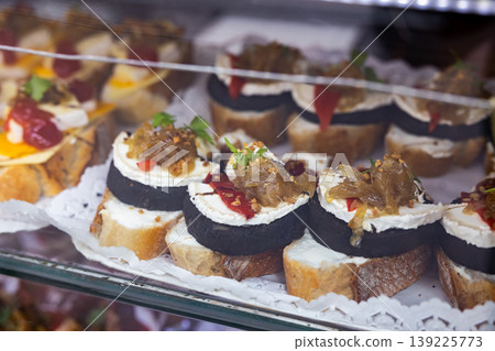 Spanish snack pincho in bakery window Spanish snack pincho in bakery window 139225773