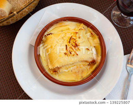 Meat lasagne with cheese served on platter Meat lasagne with cheese served on platter 139225807