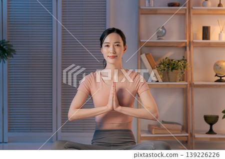 A woman who plays yoga in the room A woman who plays yoga in the room 139226226