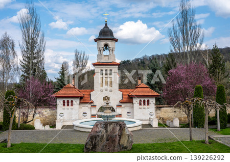 White Bell Tower and Stone Fountain at Curchi Monastery Grounds 139226292
