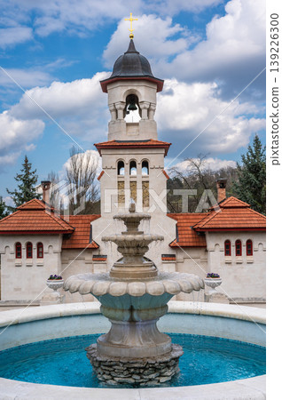 White Bell Tower and Stone Fountain at Curchi Monastery Grounds White Bell Tower and Stone Fountain at Curchi Monastery Grounds 139226300