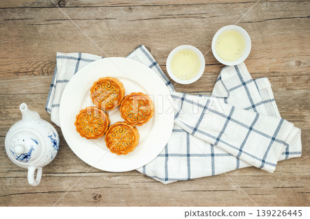 Mooncakes, Tea, and Mid-Autumn Festival Feast Mooncakes, Tea, and Mid-Autumn Festival Feast 139226445